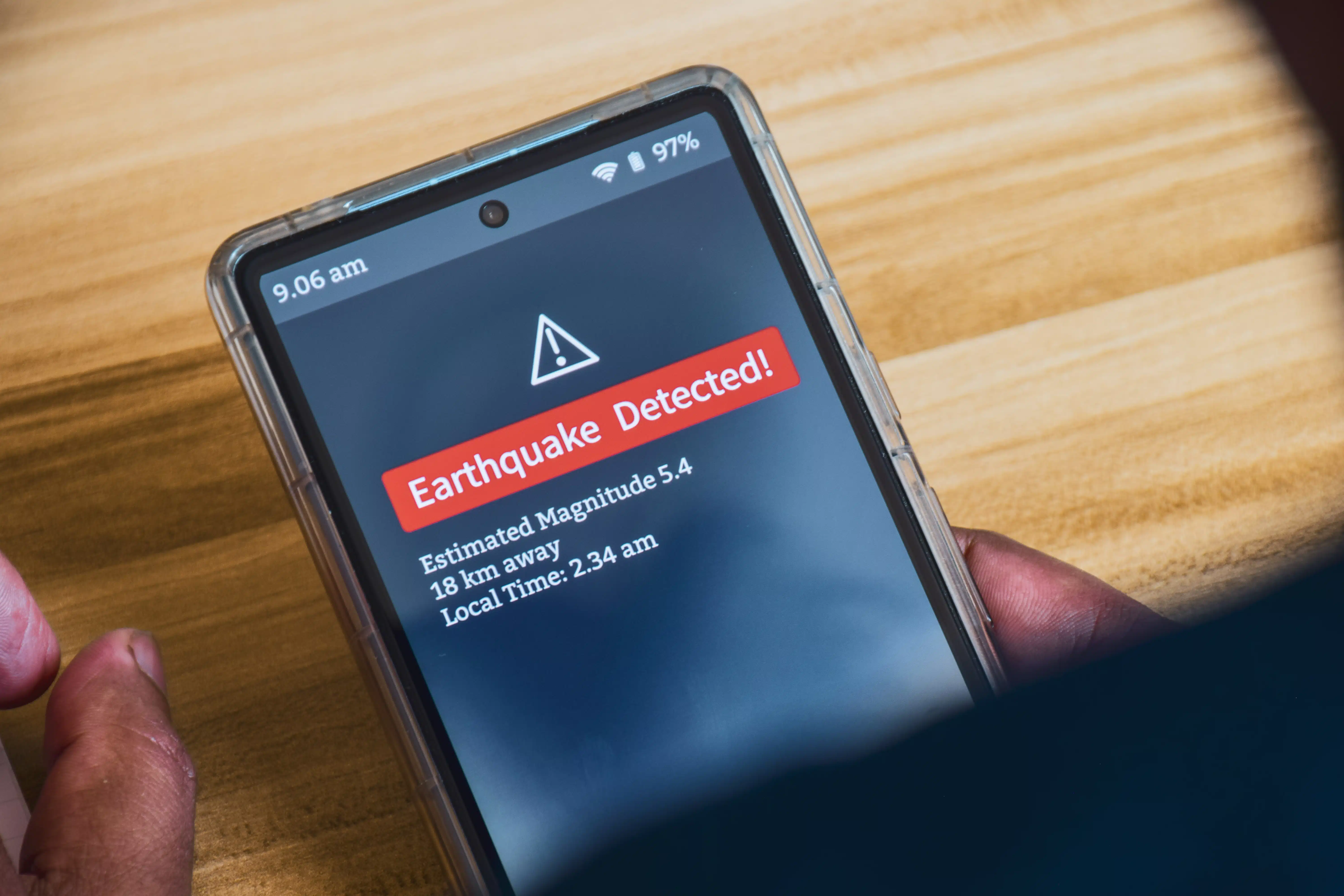 Earthquake detection alert notification on smartphone.